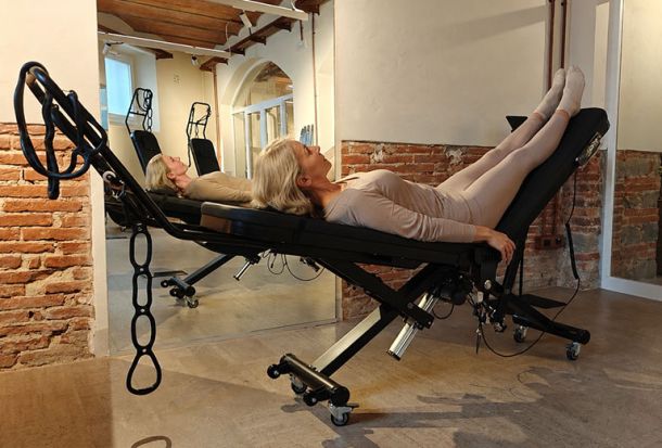 Woman practising gentle mobility and breath-focused movement in a Vobees Recharge session
